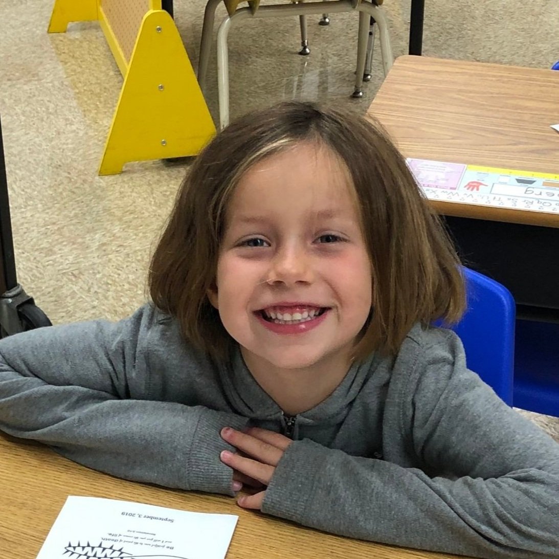 Smiling student at her desk