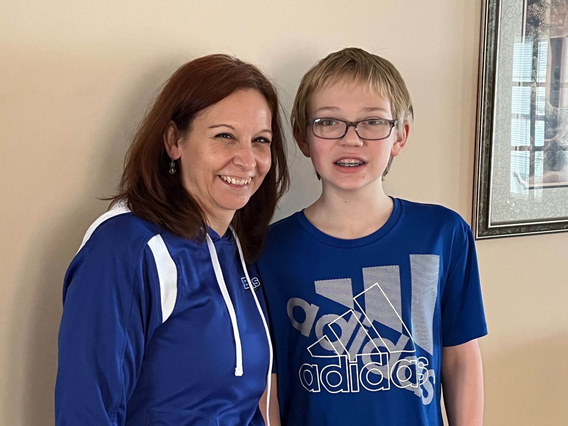 Teacher and student smiling together