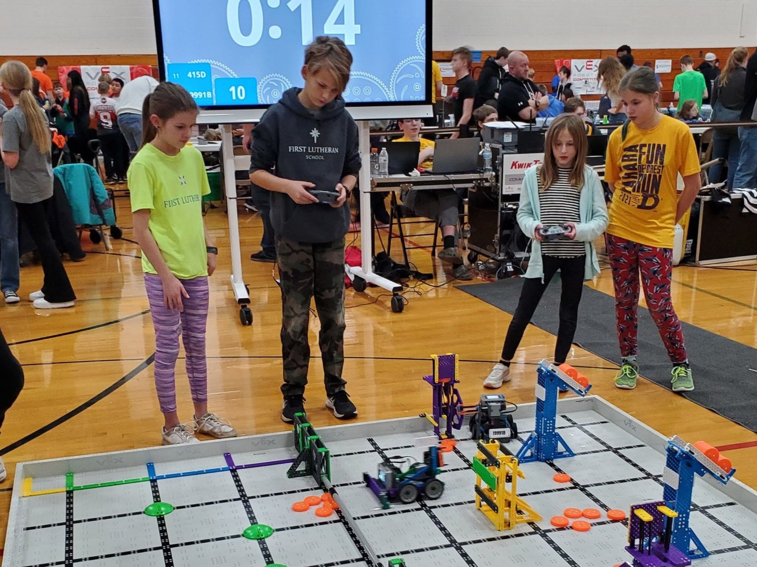 Students competing at a robotics tournament